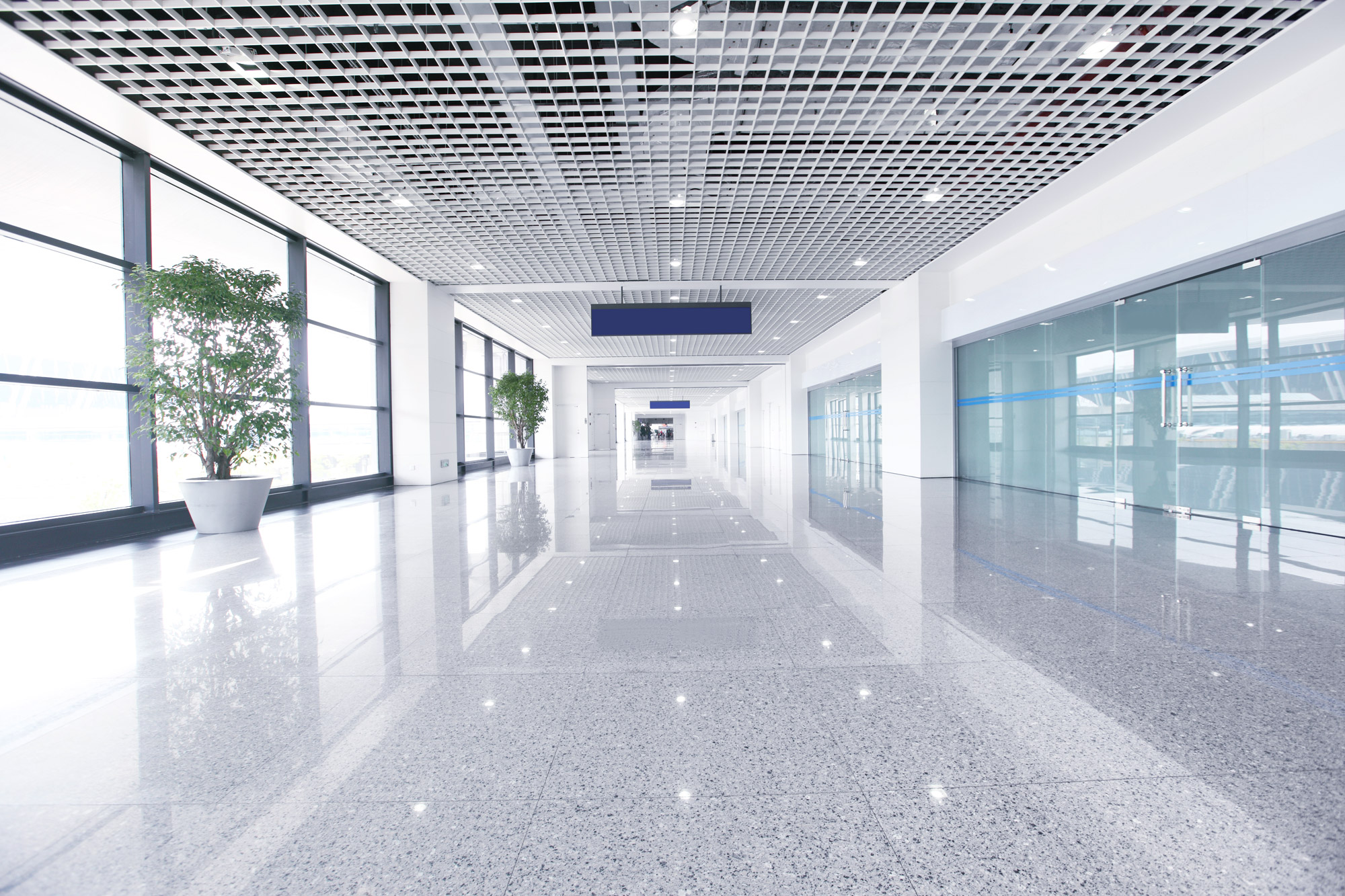 spotless commercial building hallway with shiny marble floors
